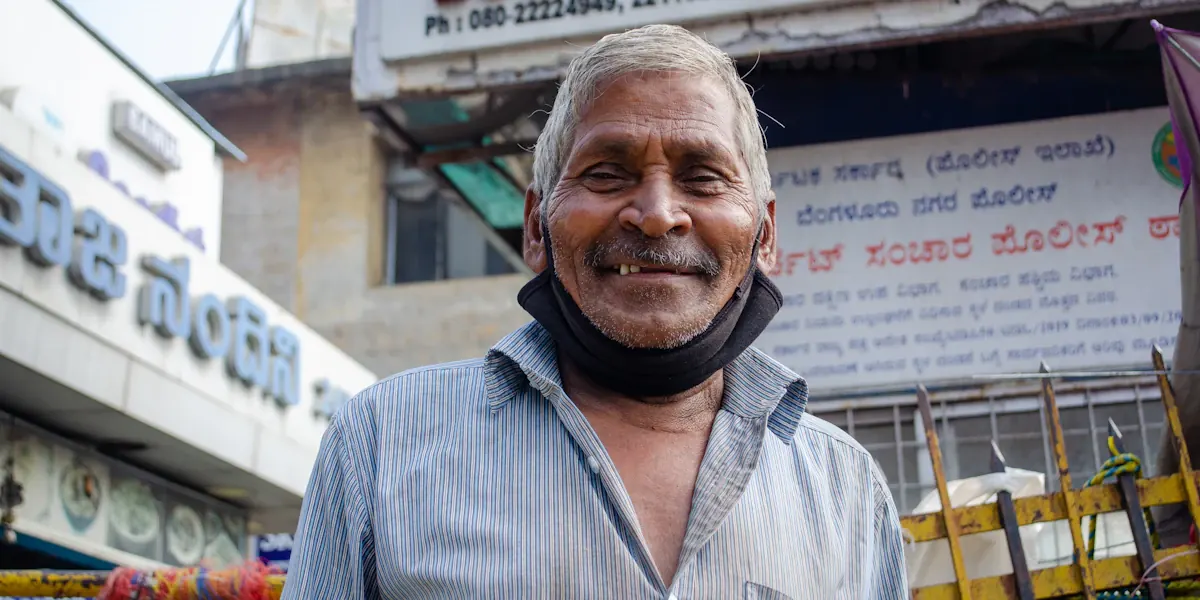 Small business owner standing in front of his shop